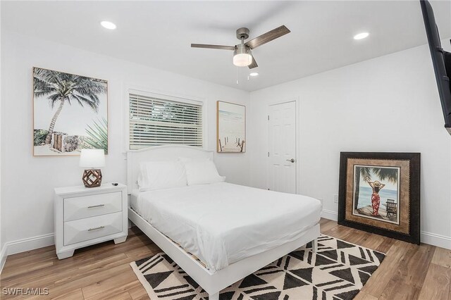 bedroom featuring light hardwood / wood-style flooring and ceiling fan