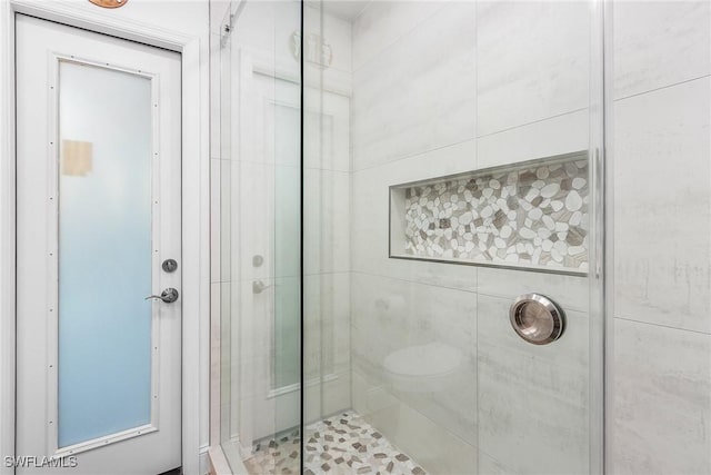 bathroom featuring an enclosed shower