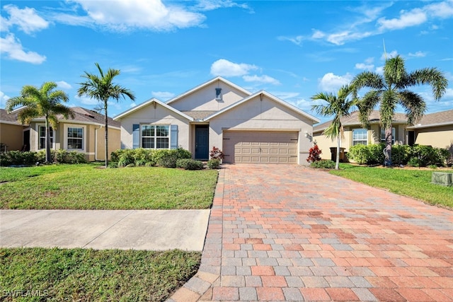 ranch-style house featuring a garage and a front lawn