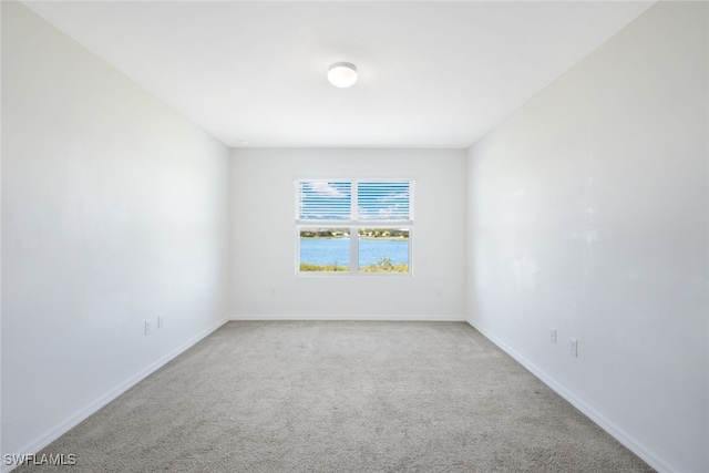 empty room featuring light colored carpet