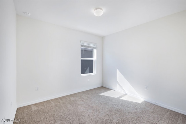 empty room featuring light carpet