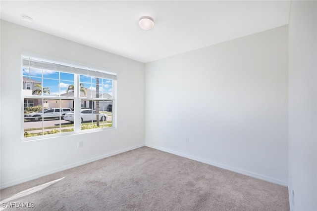 unfurnished room featuring carpet floors