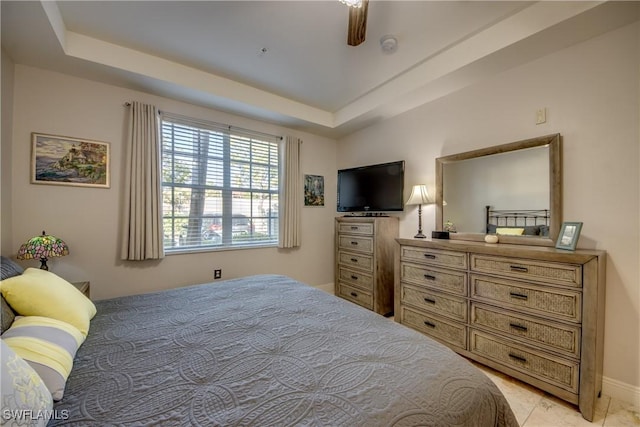 bedroom featuring a tray ceiling