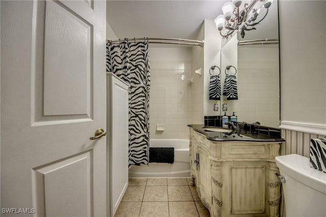 full bathroom featuring tile patterned flooring, vanity, toilet, and shower / bath combo