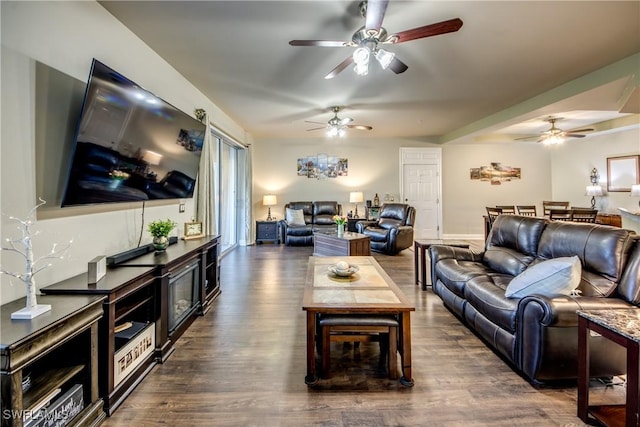 living room with dark hardwood / wood-style floors and ceiling fan