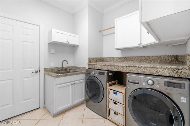 15881 Delasol Ln, Naples, FL 34110 - laundry area with cabinet space, washing machine and dryer, ornamental molding, light tile patterned flooring, and bar area