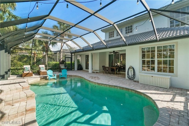 15881 Delasol Ln, Naples, FL 34110 - swimming pool with a patio area, ceiling fan, and a lanai