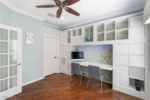 office space with built in study area, dark wood-style floors, visible vents, a ceiling fan, and ornamental molding