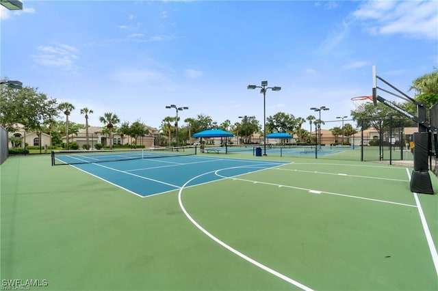 15881 Delasol Ln, Naples, FL 34110 - view of basketball court featuring a tennis court and community basketball court