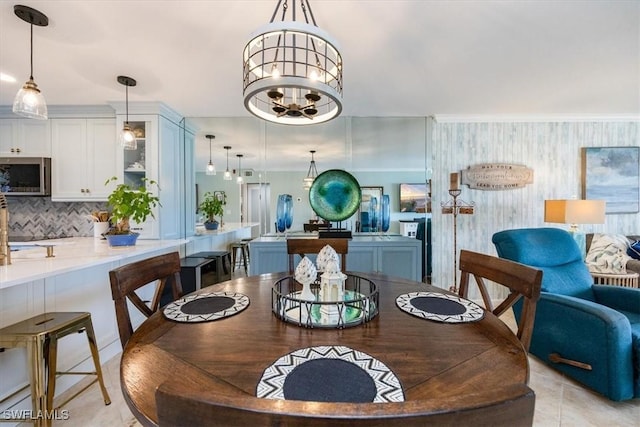 4572 Andover Way Unit C102, Naples, FL 34112 - dining area with a chandelier