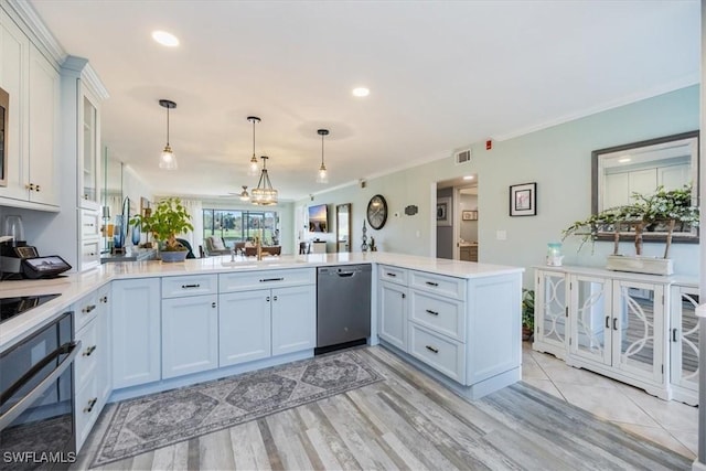 4572 Andover Way Unit C102, Naples, FL 34112 - kitchen featuring light countertops, pendant lighting, dishwasher, a peninsula, and wall oven