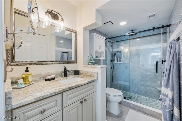 4572 Andover Way Unit C102, Naples, FL 34112 - full bath featuring vanity, visible vents, toilet, and a shower stall