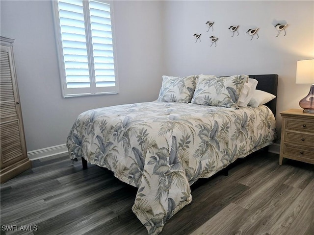 bedroom featuring dark hardwood / wood-style flooring