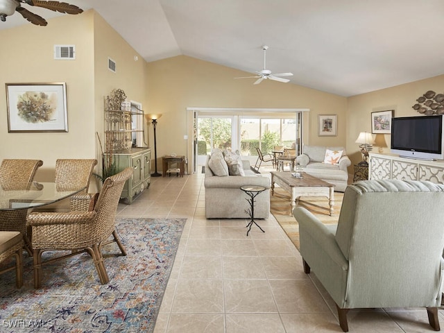 living room with light tile patterned flooring, lofted ceiling, and ceiling fan