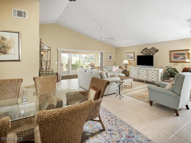 living room featuring vaulted ceiling, ceiling fan, and light tile patterned flooring