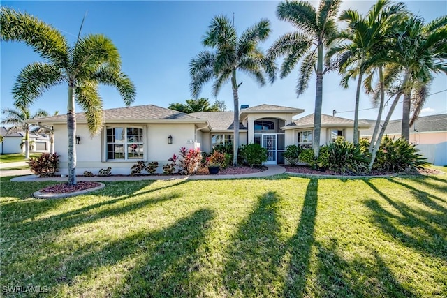 ranch-style house featuring a front lawn