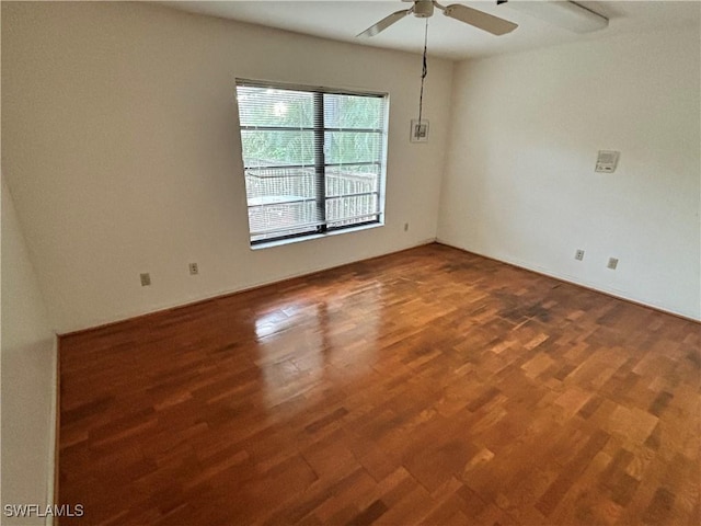 spare room with wood-type flooring and ceiling fan