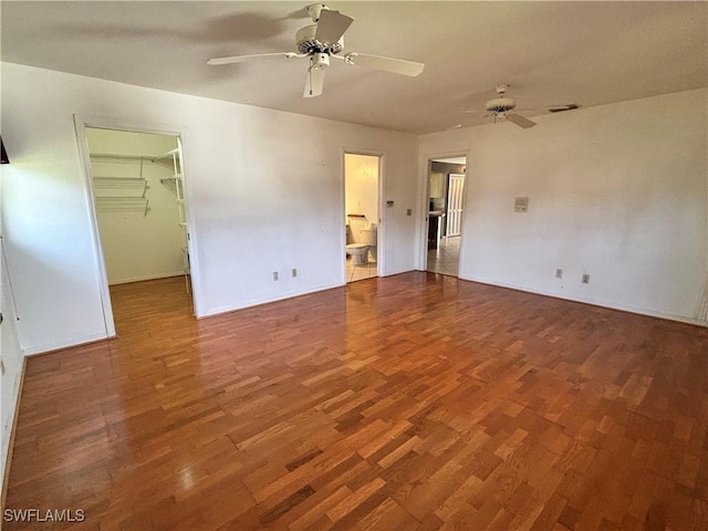 empty room with hardwood / wood-style flooring and ceiling fan