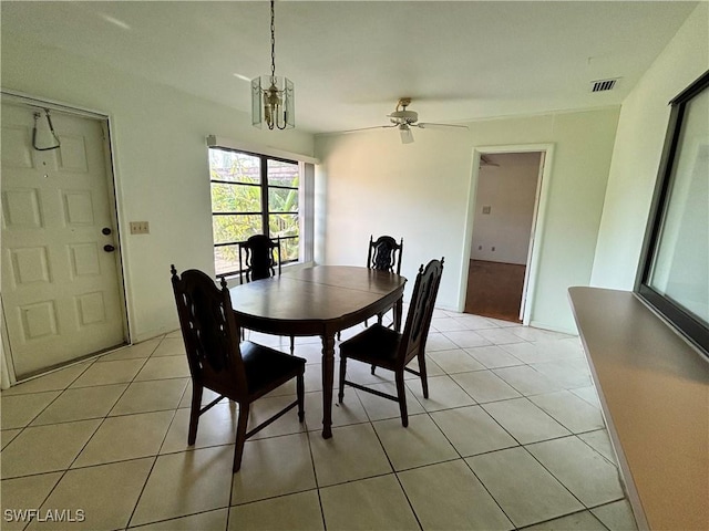 dining area featuring light tile patterned flooring and ceiling fan