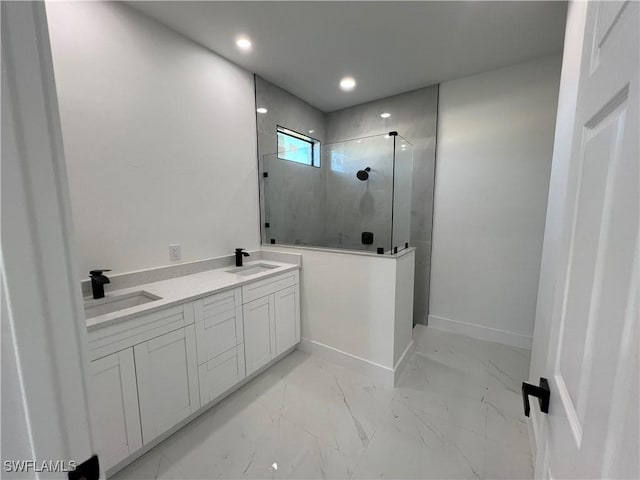 bathroom featuring tiled shower and vanity