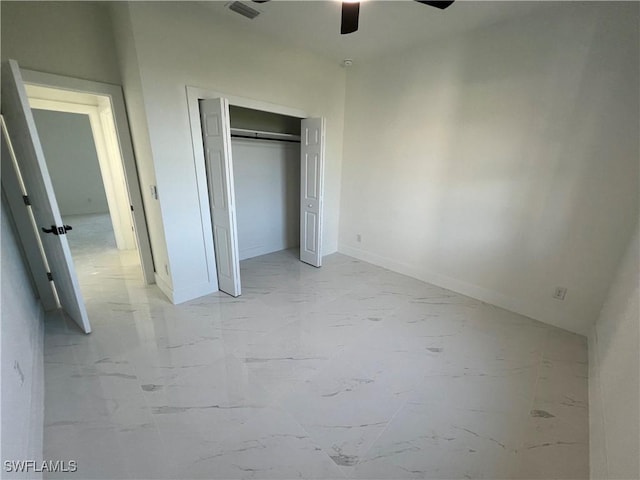 unfurnished bedroom featuring ceiling fan and a closet