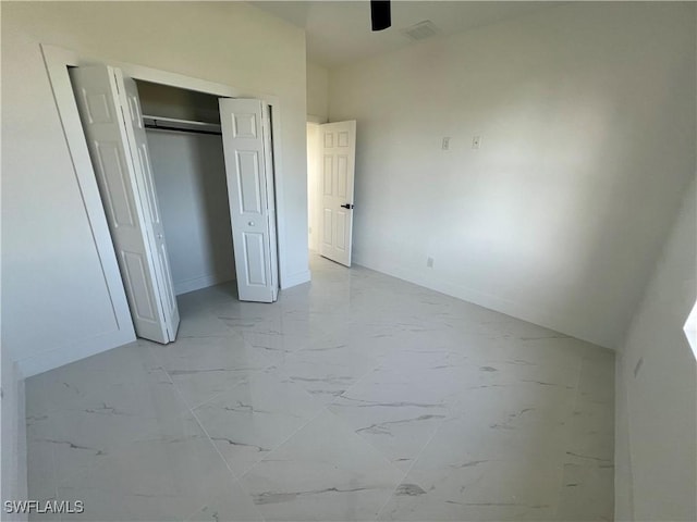 unfurnished bedroom with a closet