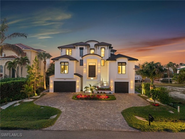 mediterranean / spanish house with a garage