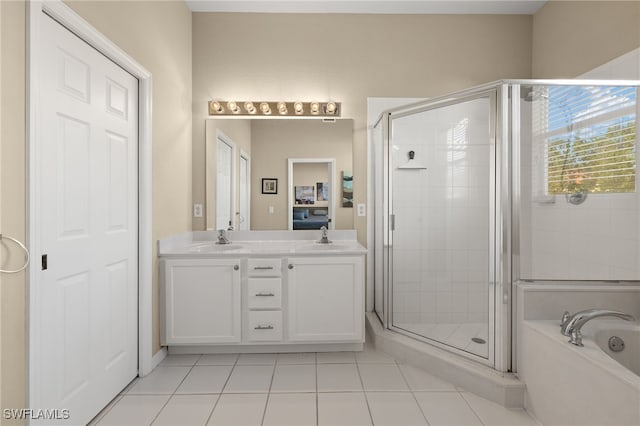 bathroom with vanity, separate shower and tub, and tile patterned floors