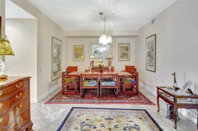 dining room featuring visible vents and baseboards