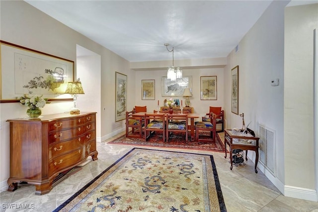 dining room featuring marble finish floor, visible vents, and baseboards