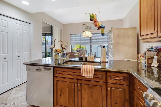 kitchen with dishwashing machine, a sink, brown cabinets, dark stone countertops, and white electric range oven