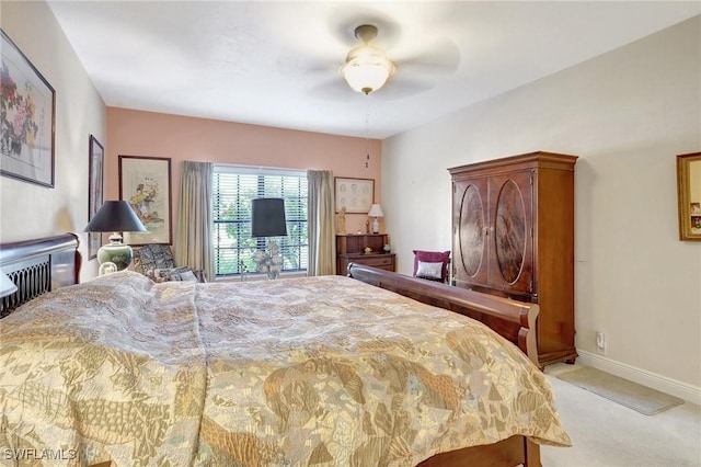 bedroom with baseboards, ceiling fan, and light colored carpet