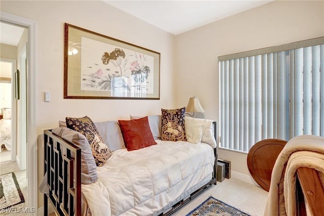 bedroom with carpet floors and baseboards