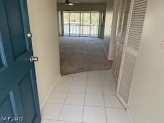 hallway with light tile patterned floors