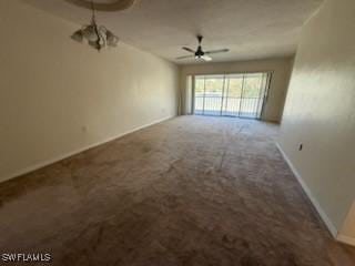 unfurnished room with ceiling fan and carpet