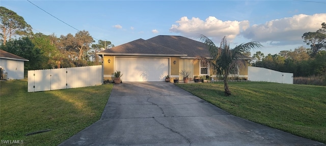 single story home featuring a garage and a front yard