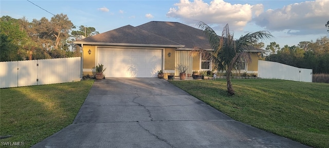 view of front facade featuring a garage and a front yard