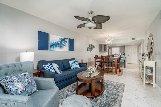 tiled living room featuring ceiling fan