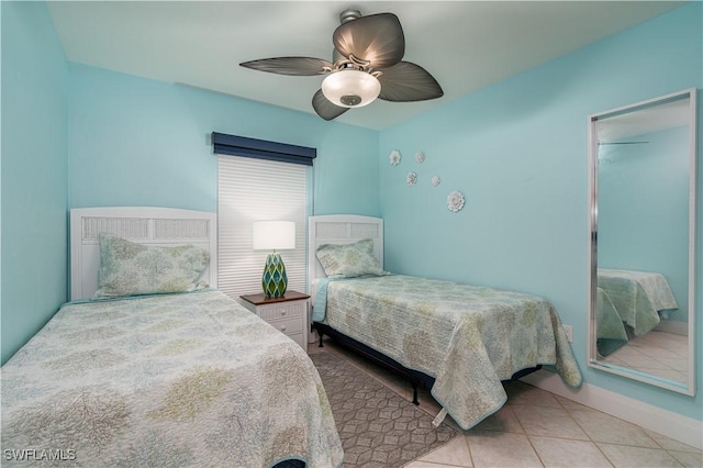 bedroom featuring light tile patterned floors and ceiling fan