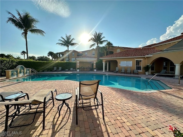 view of swimming pool with a patio