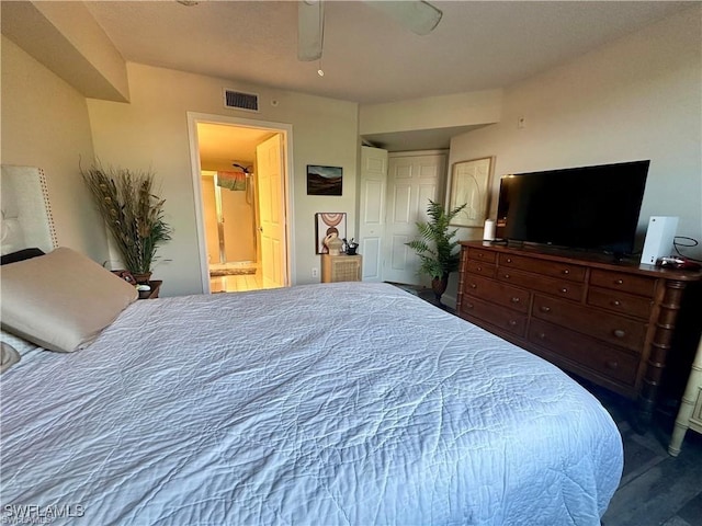 bedroom with ceiling fan and ensuite bathroom