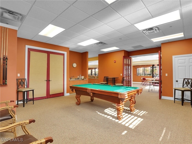 rec room with carpet, billiards, a paneled ceiling, and french doors