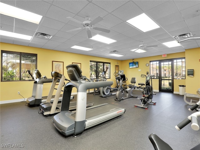 workout area featuring a drop ceiling and ceiling fan