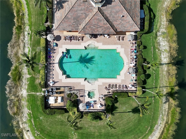 birds eye view of property with a water view