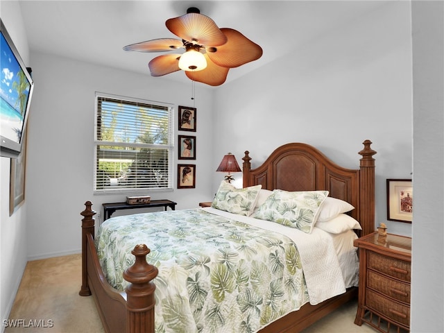 bedroom with light carpet and ceiling fan