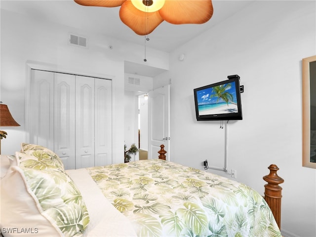 bedroom with ceiling fan and a closet