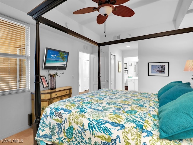 carpeted bedroom with ceiling fan and ensuite bathroom