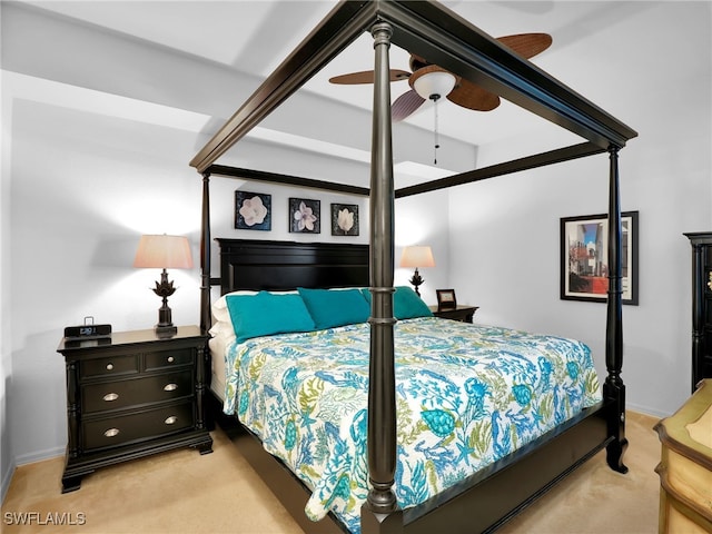 bedroom with ceiling fan and light colored carpet