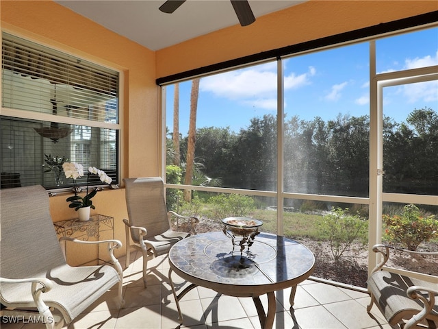 sunroom / solarium with ceiling fan and a healthy amount of sunlight