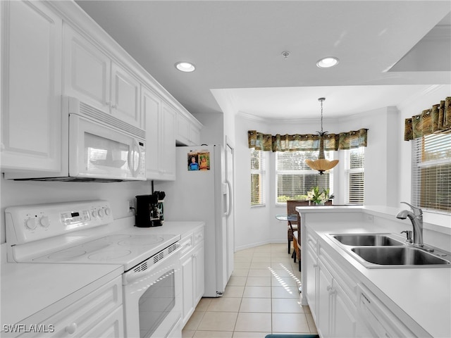 kitchen featuring sink, light tile patterned floors, white cabinets, and white appliances